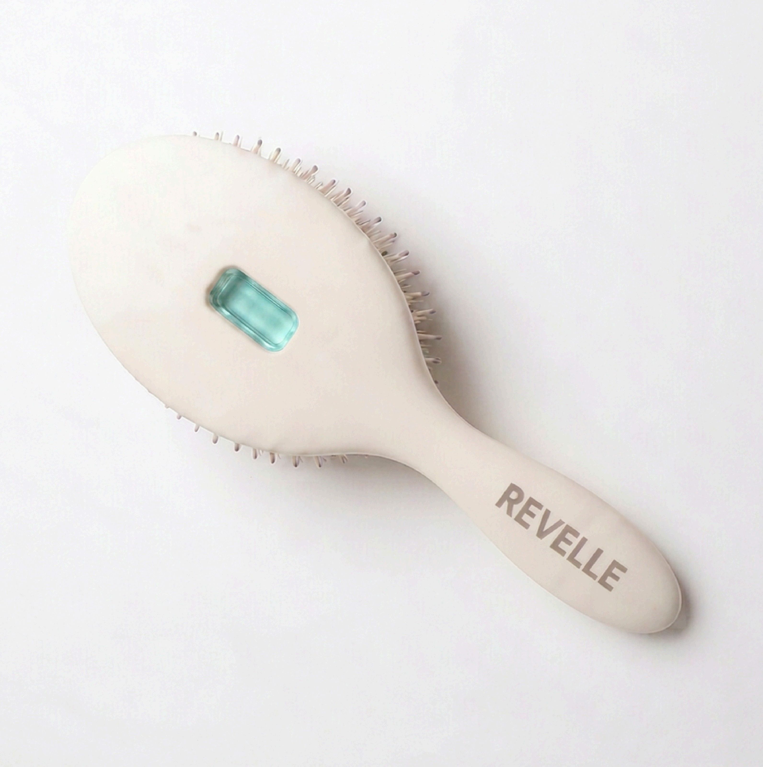 The Revelle brush in Chalk with a teal treatment pod window